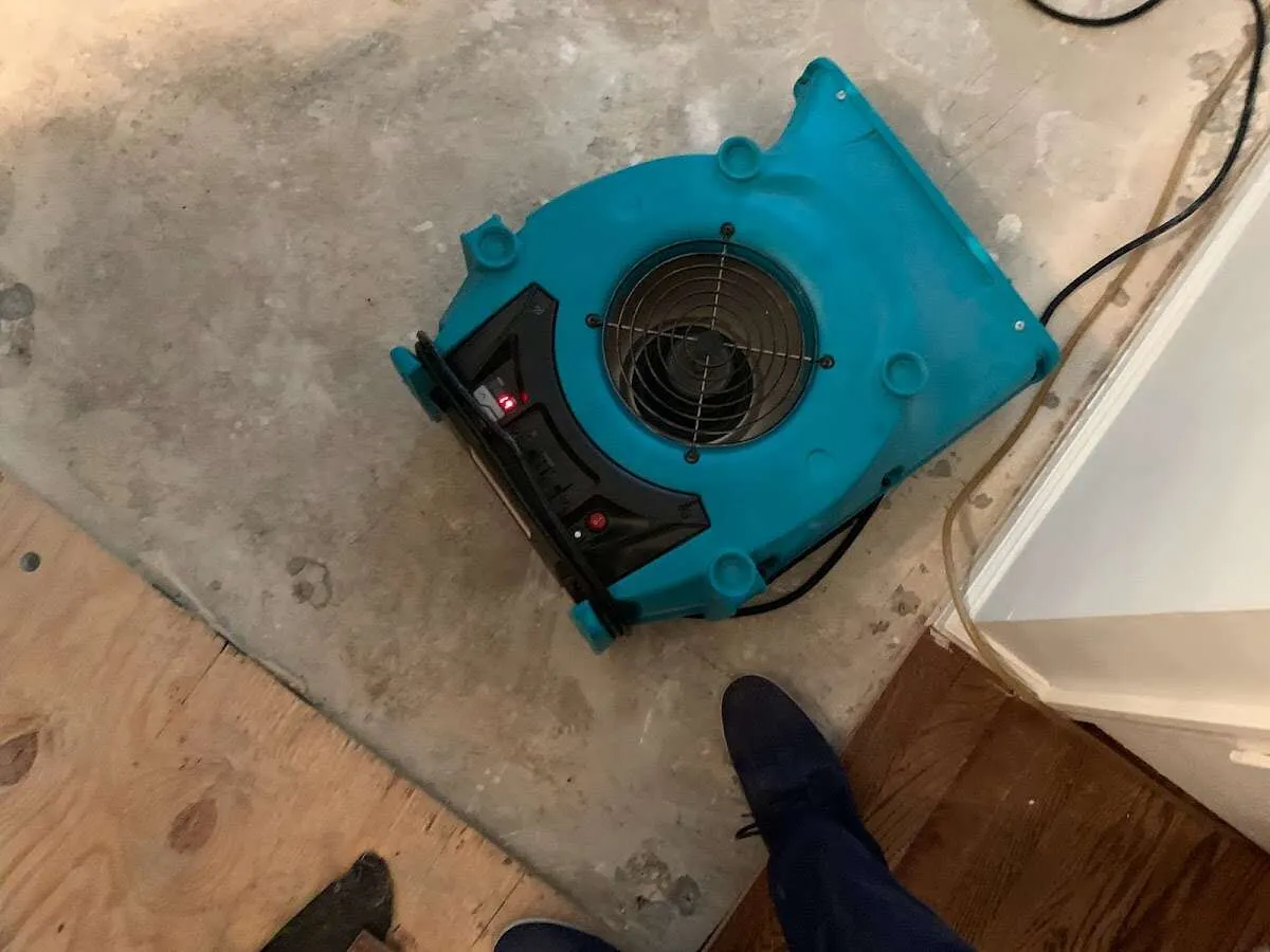 Air mover drying subfloor during Leak Detection & Repair in La Quinta
